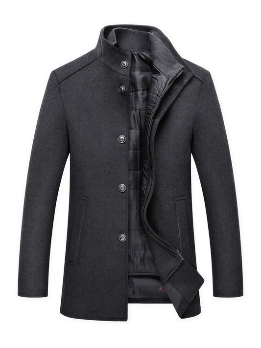 Men's dark grey slim fit wool winter coat featuring a high funnel neck collar, button and zipper closure, and thick quilted inner lining.