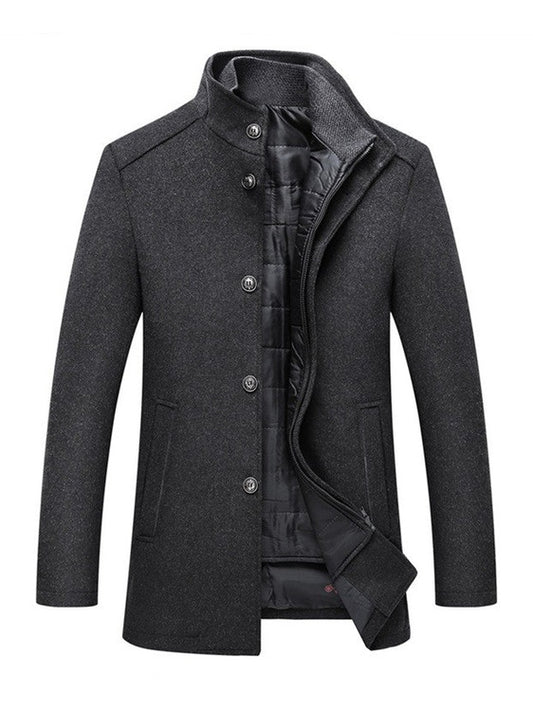Men's dark grey slim fit wool winter coat featuring a high funnel neck collar, button and zipper closure, and thick quilted inner lining.