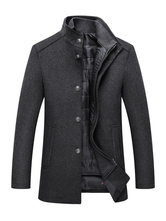 Men's dark grey slim fit wool winter coat featuring a high funnel neck collar, button and zipper closure, and thick quilted inner lining.